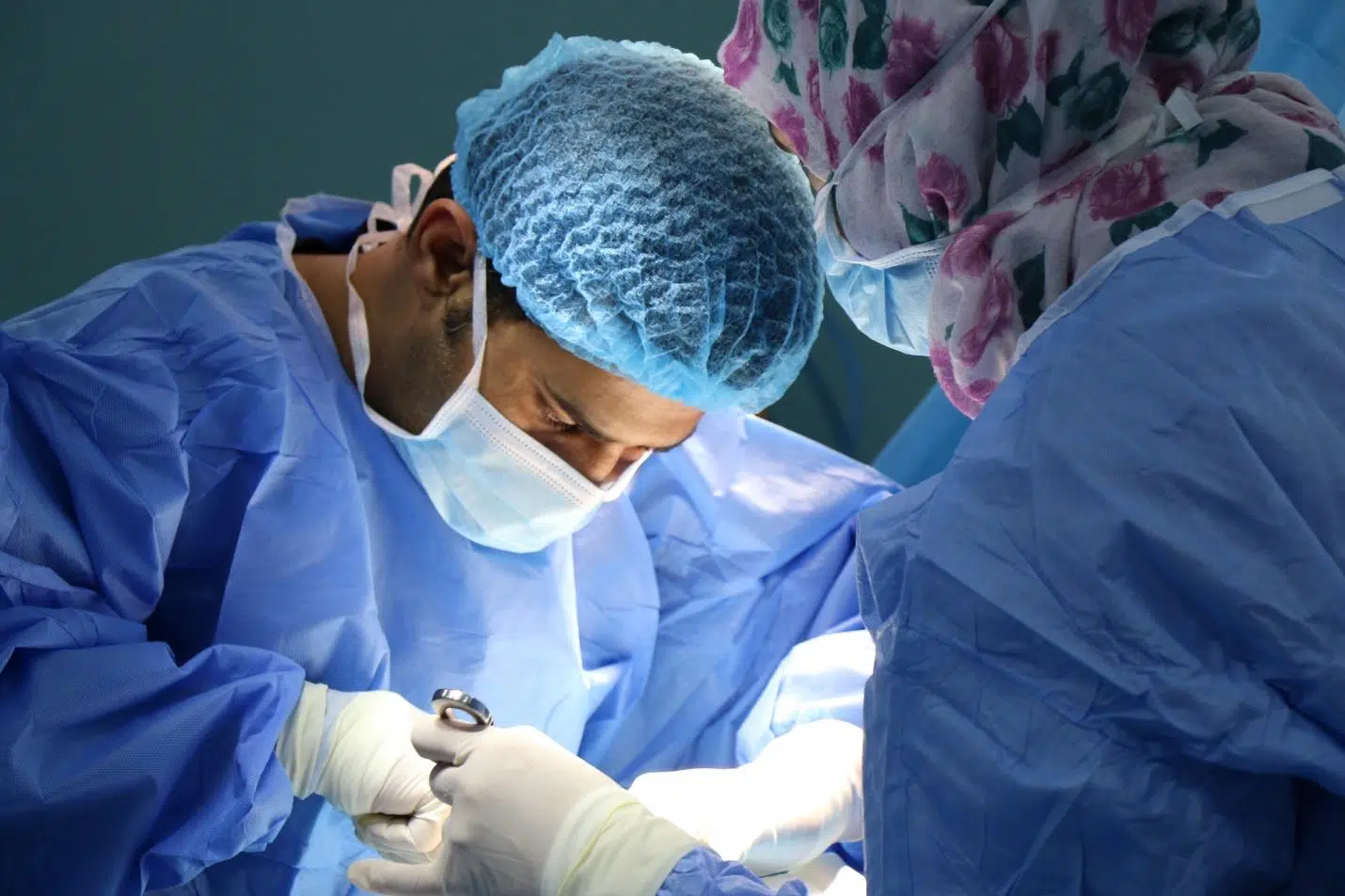 A surgeon performing labiaplast