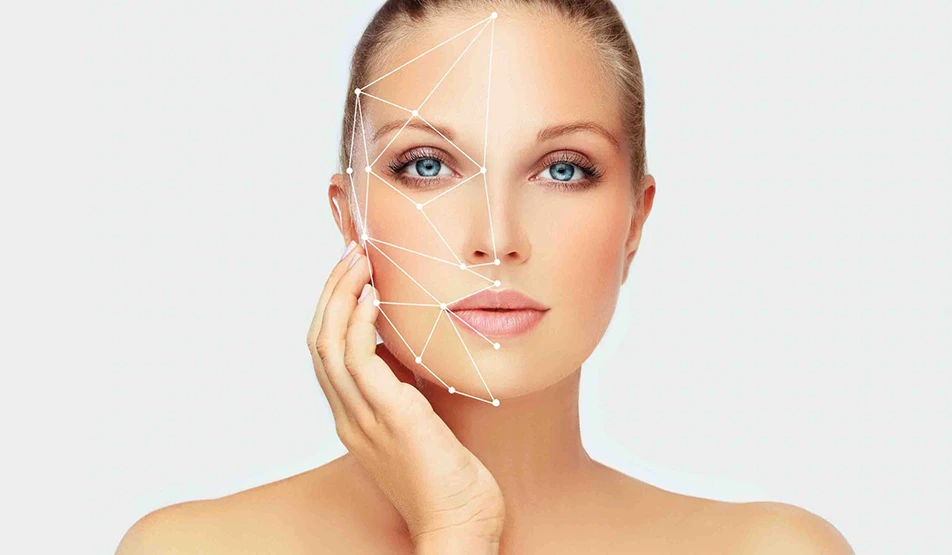 Woman’s face with geometric facial mapping lines showing symmetry and golden ratio proportions used in cosmetic surgery