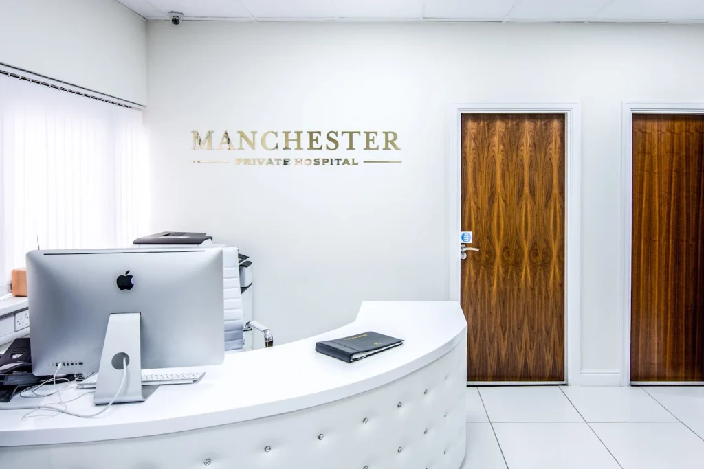 Reception area of Manchester Private Hospital with seating and modern front desk