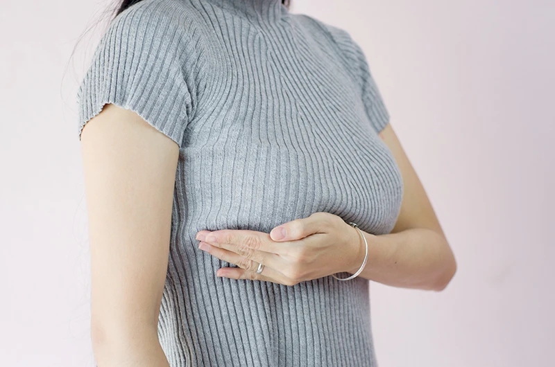 woman-self-check-for-sagging-breasts