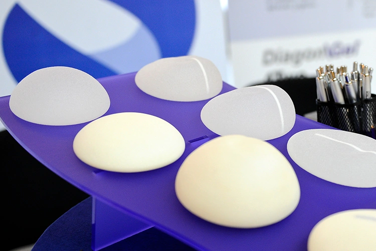 Display of teardrop and round breast implant shapes used in breast augmentation consultations at Manchester Private Hospital.
