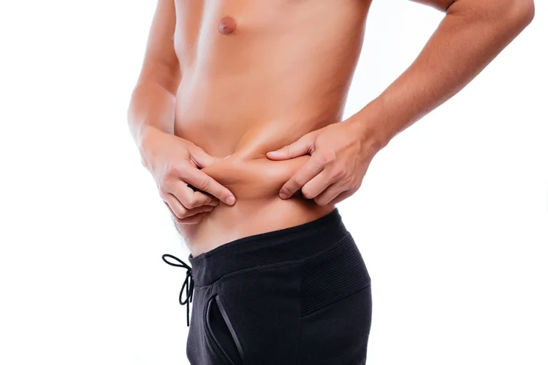Close-up of male waist showing stubborn love handle fat